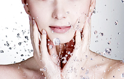 Drops of water around the beautiful woman face